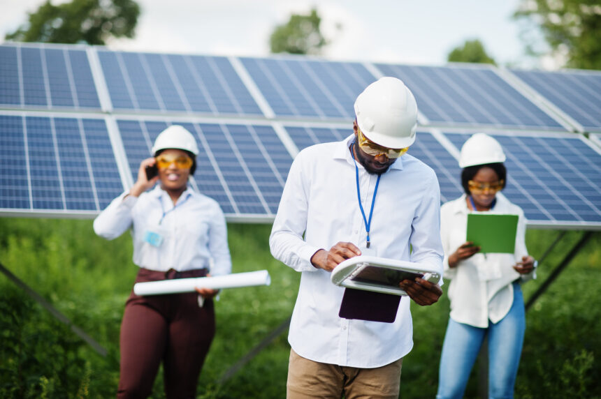 African american technician checks the maintenance of the solar Powering South Africa’s Energy and Water Transitions
