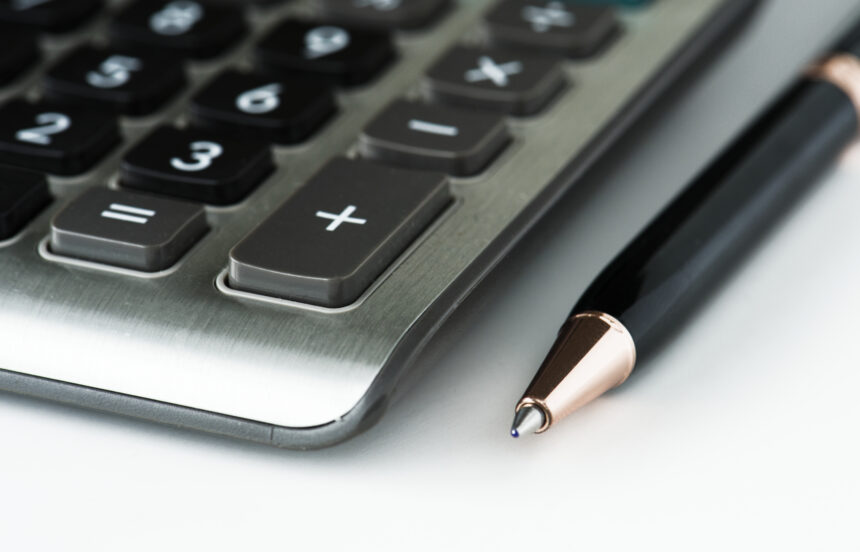 CLoseup of calculator with pen Unlocking Opportunities in South Africa’s Financial Services Skills Pipeline