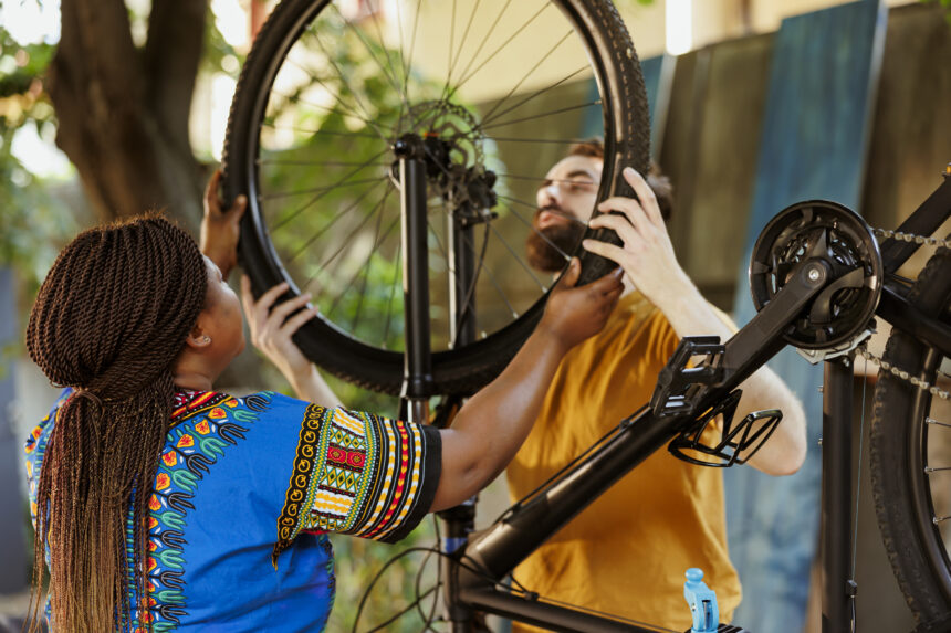 Energetic couple dismantling bicycle Empowering Culture, Tourism, and Hospitality for Inclusive Growth