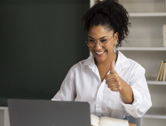 medium-shot-woman-showing-thumbs-up Qualifications driving South Africa’s engineering & Manufacturing Revival